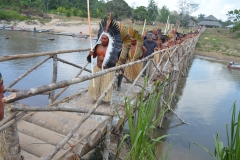 Tribe crossing the Yawanawa bridge